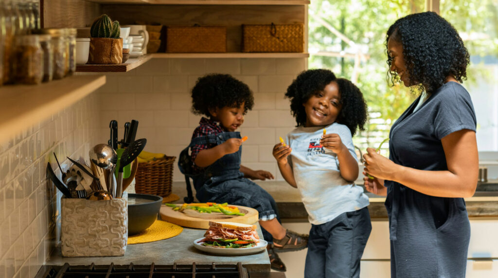 mom and daughters in kitchen