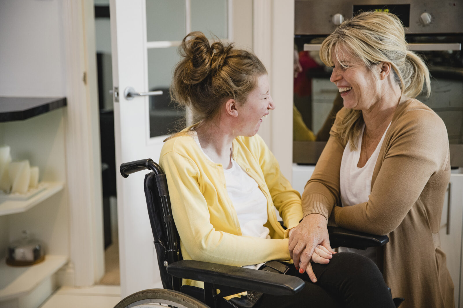Mom and Disabled Daughter in Kitchen